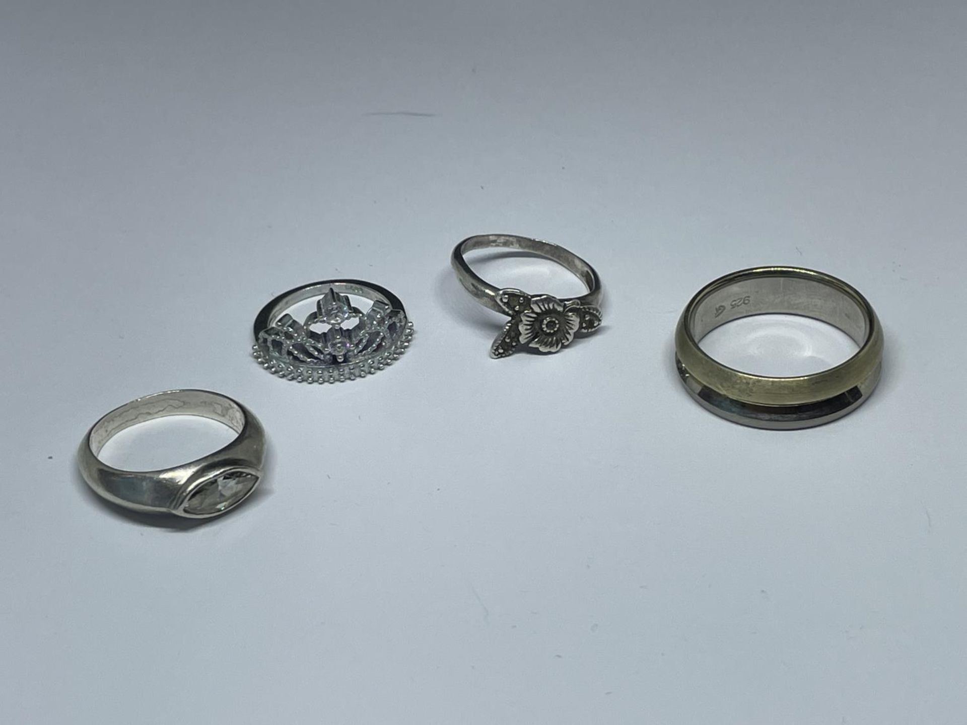 FOUR ASSORTED SILVER RINGS