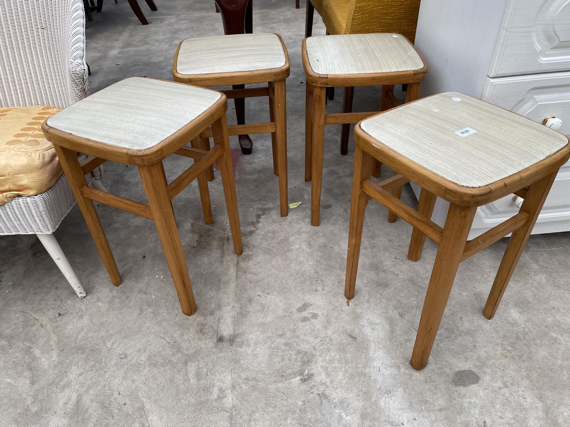 A SET OF FOUR 1970'S KITCHEN STOOLS