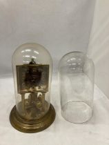 A VINTAGE SQUARE FACED ANNIVERSARY CLOCK WITH GLASS DOME AND A FURTHER DOME