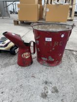 A VINTAGE FIRE BUCKET AND A VINTAGE ESSO OIL JUG