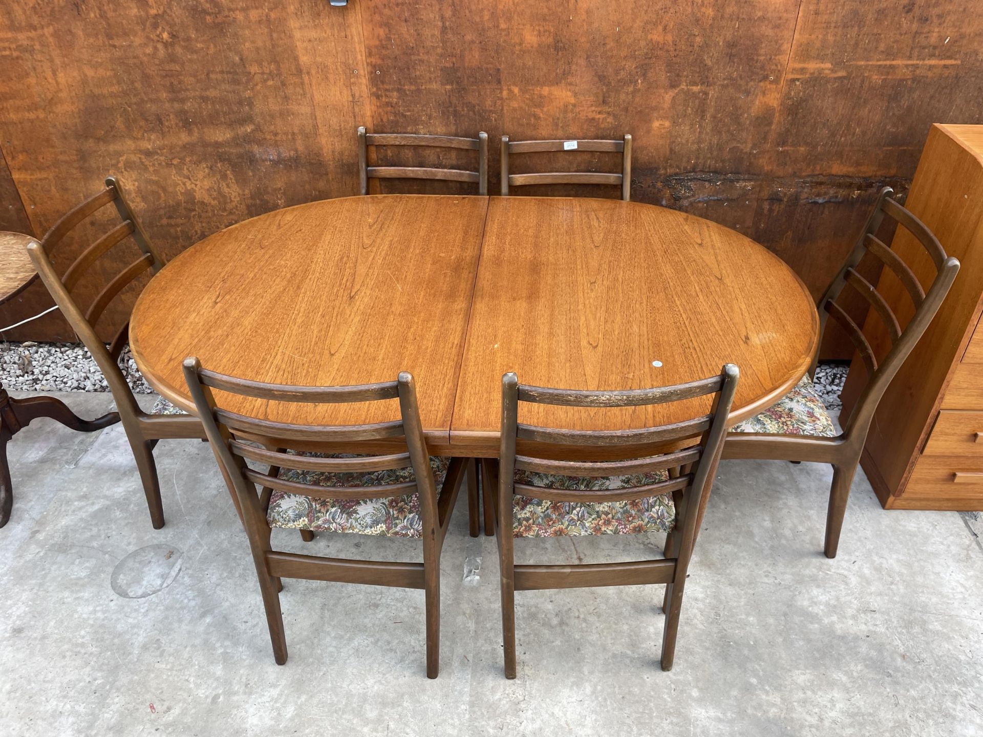 A G-PLAN RETRO TEAK EXTENDING DINING TABLE, 64 X 44" (LEAF 18") AND SIX LADDERBACK DINING CHAIRS