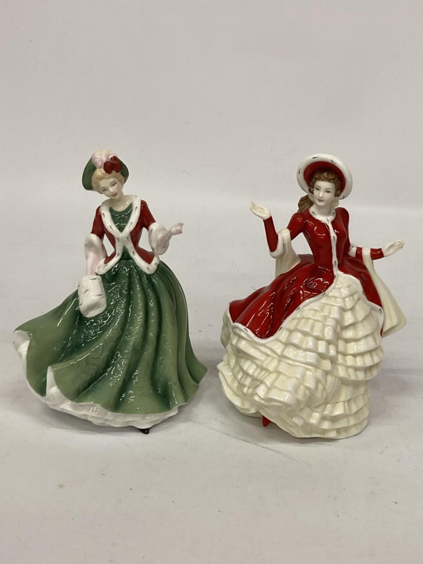 TWO ROYAL DOULTON FIGURINES FROM THE PRETTY LADIES COLLECTION BOTH TITLED "CHRISTMAS DAY"