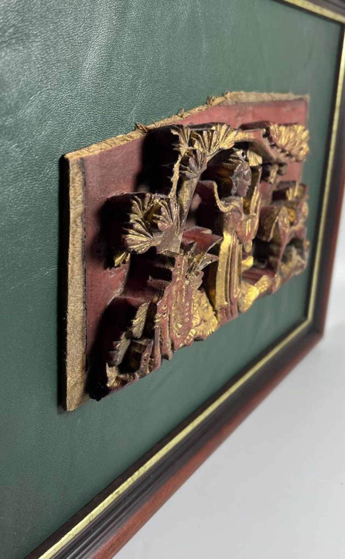 A CHINESE LACQUERED AND GILT CARVED WOODEN PANEL, ON LATER GREEN LEATHER MOUNT AND WOODEN FRAME, - Image 2 of 5
