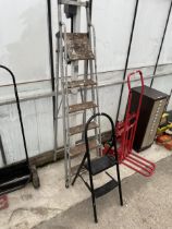 A FIVE RUNG WOODEN AND METAL STEP LADDER AND A FURTHER TWO RUNG STEP LADDER
