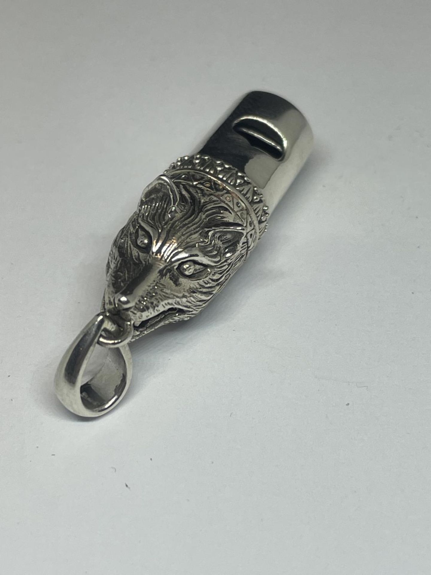 A SILVER FOX WHISTLE PENDANT