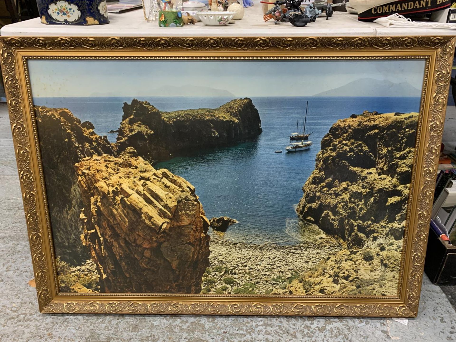 A LARGE FRAMED PRINT OF BOATS NEAR A BEACH - Image 2 of 2