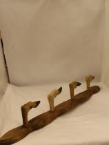 A WALL MOUNTED FOUR 'HOOFED' COAT RACK