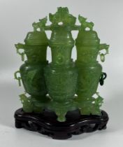 A JADE STYLE HARDSTONE QUADRUPLE LIDDED VASE ON WOODEN VASE, HEIGHT 20 CM