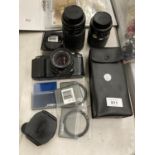 A CANON T50 CAMERA, 3 LENSES, ASSORTED FILTERS AND EXTRAS