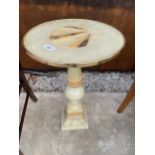 AN ONYX PEDESTAL TABLE WITH SUNBURST TOP - 14" DIAMETER