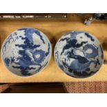 TWO VINTAGE BLUE AND WHITE CHINESE BOWLS WITH DRAGON DESIGN