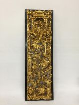 A CHINESE GILT CARVED LACQUERED WOODEN BATTLE SCENE PLAQUE PANEL