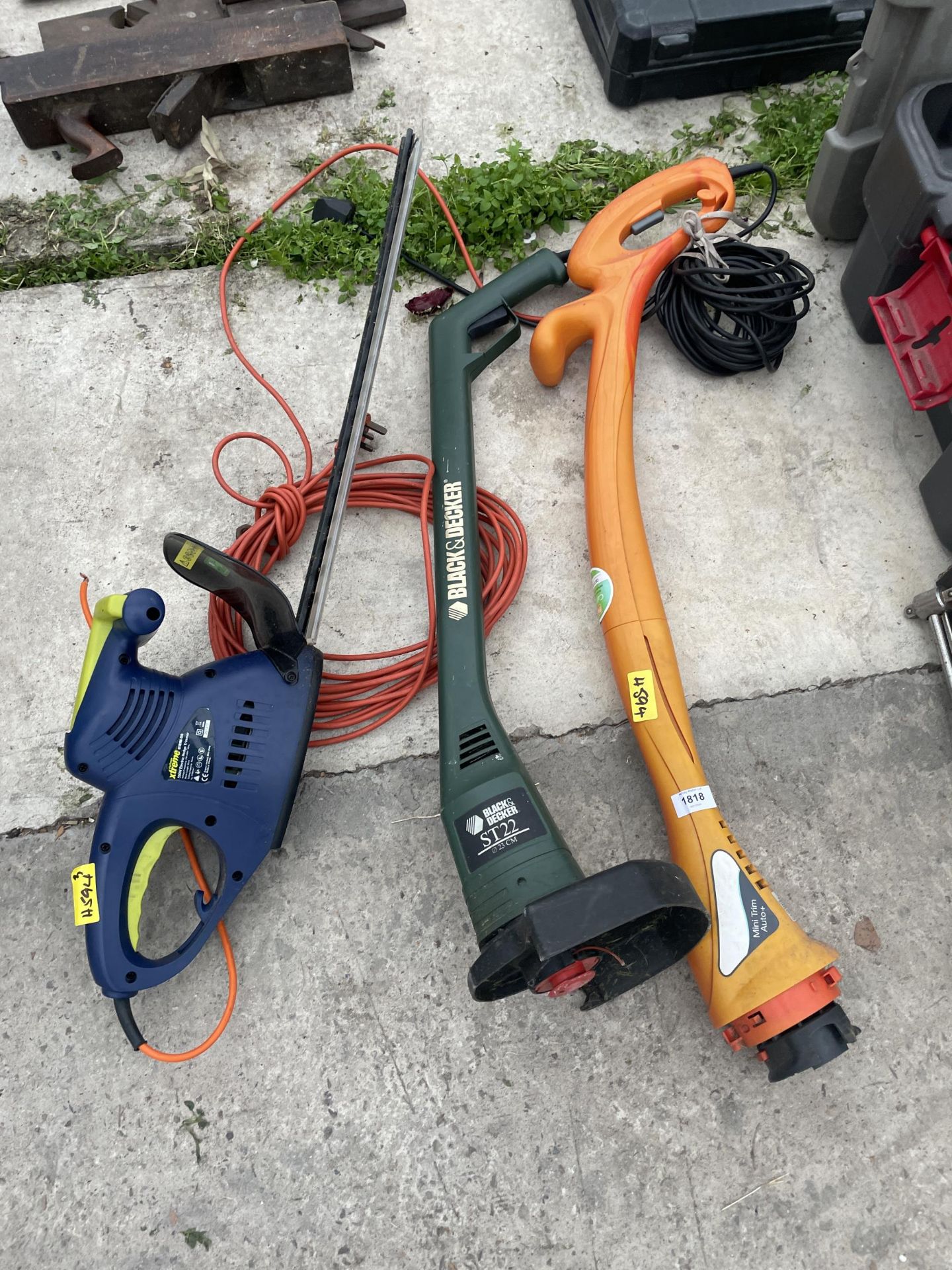 THREE ELECTRIC GARDEN TOOLS TO INCLUDE TWO STRIMMERS AND A XTREME HEDGE CUTTER