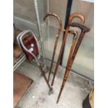 FIVE VARIOUS WALKING STICKS TO INCLUDE A SHOOTING STICK ETC