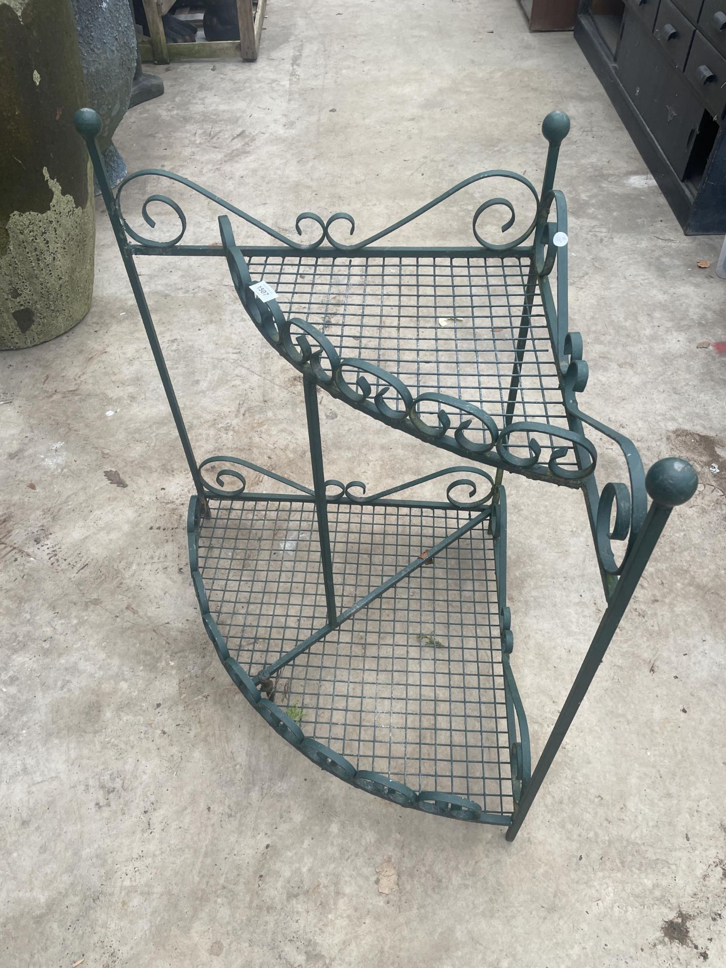 A VINTAGE WROUGHT IRON GARDEN CORNER PLANT STAND