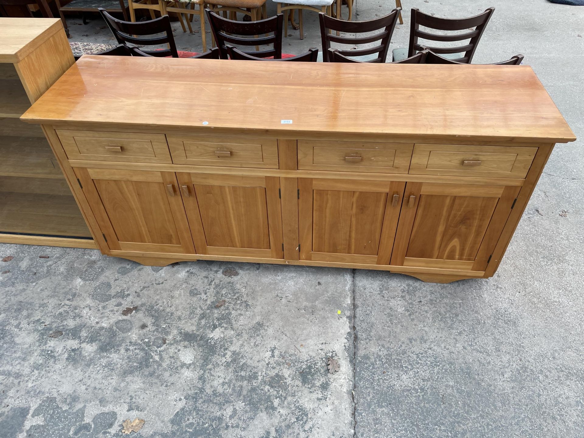 A MODERN HARDWOOD NICHOLAS G PEDLEY SIDEBOARD ENCLOSING FOUR DRAWERS AND FOUR CUPBOARDS, 75" WIDE