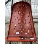 A VINTAGE WOODEN BAGATELLE GAME COMPLETE WITH BALLS