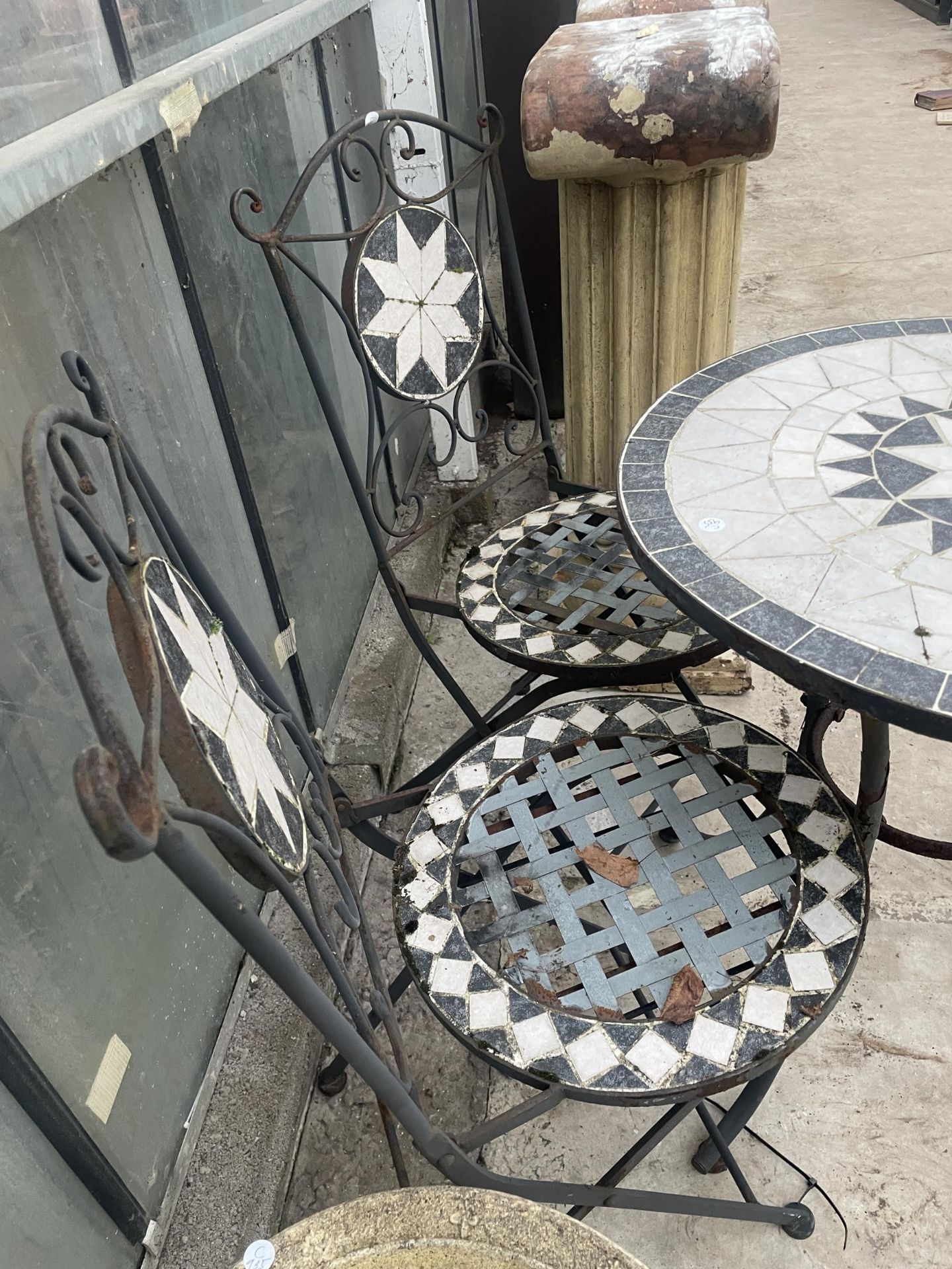 A METAL AND TILED BISTRO SET COMPRISING OF A ROUND TABLE AND TWO CHAIRS - Image 2 of 3