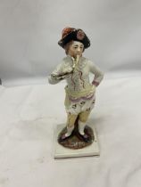AN EARLY STAFFORDSHIRE FIGURE OF A BOY