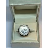 A SILVER JOEY RING IN A PRESENTATION BOX