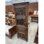 AN OAK JAYCEE CORNER CUPBOARD WITH GLAZED AND LEADED UPPER PORTION, 28" WIDE