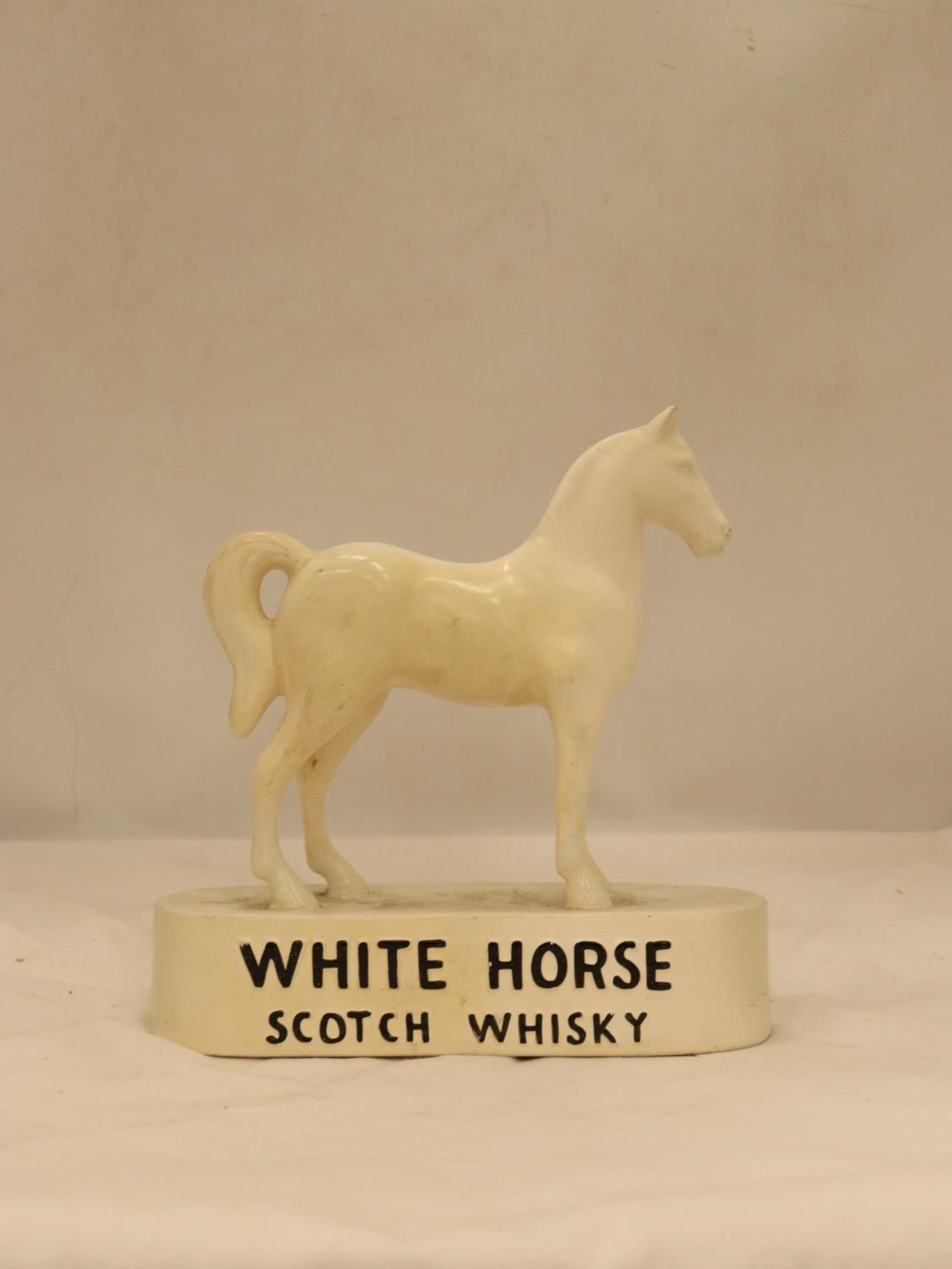 A VINTAGE KELSBORO WARE CERAMIC WHITE HORSE WHISKY ADVERTISING FIGURE