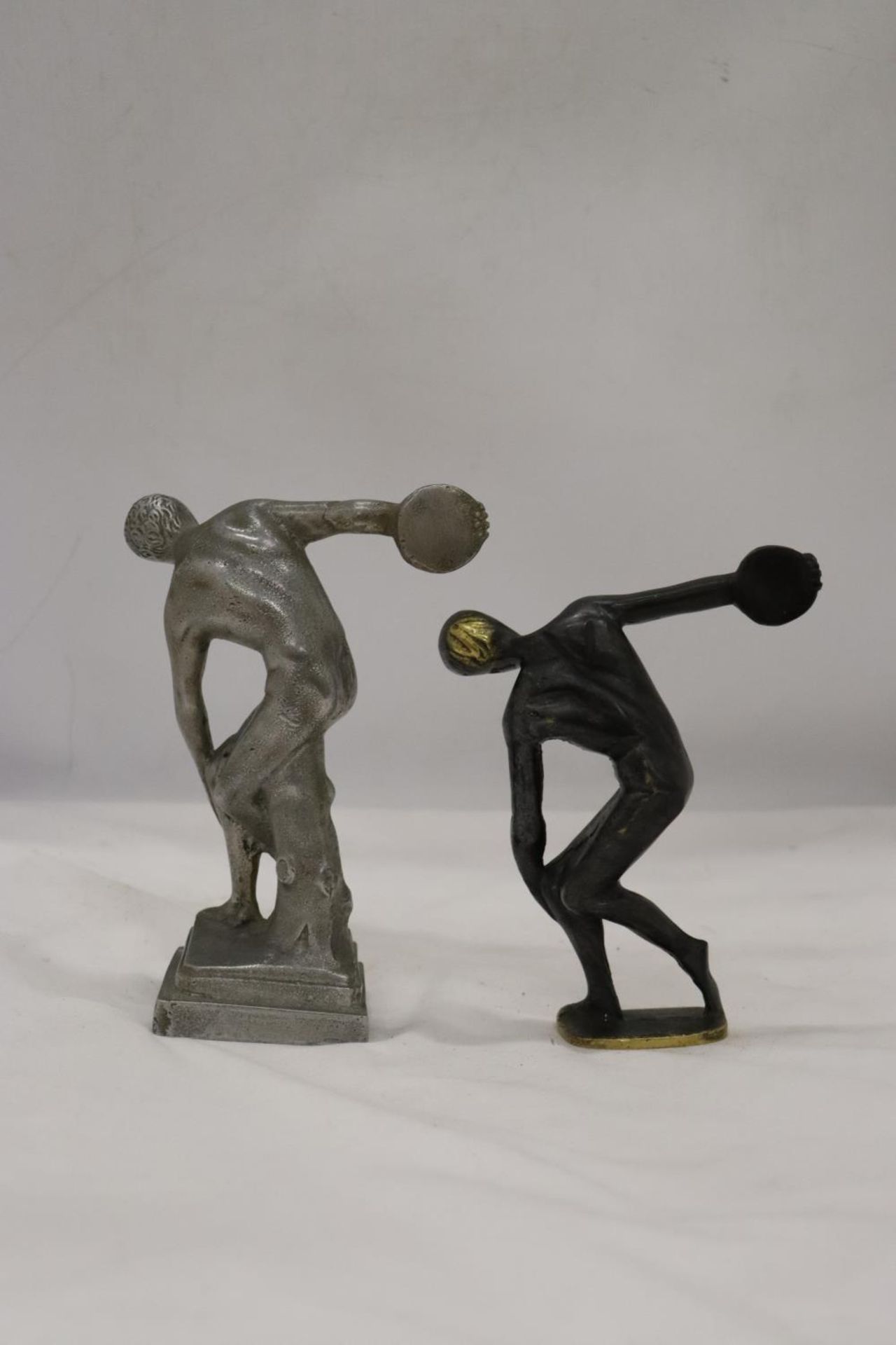 A HEAVY BRASS AND A WHITE METAL DISCUS THROWER - Image 4 of 5