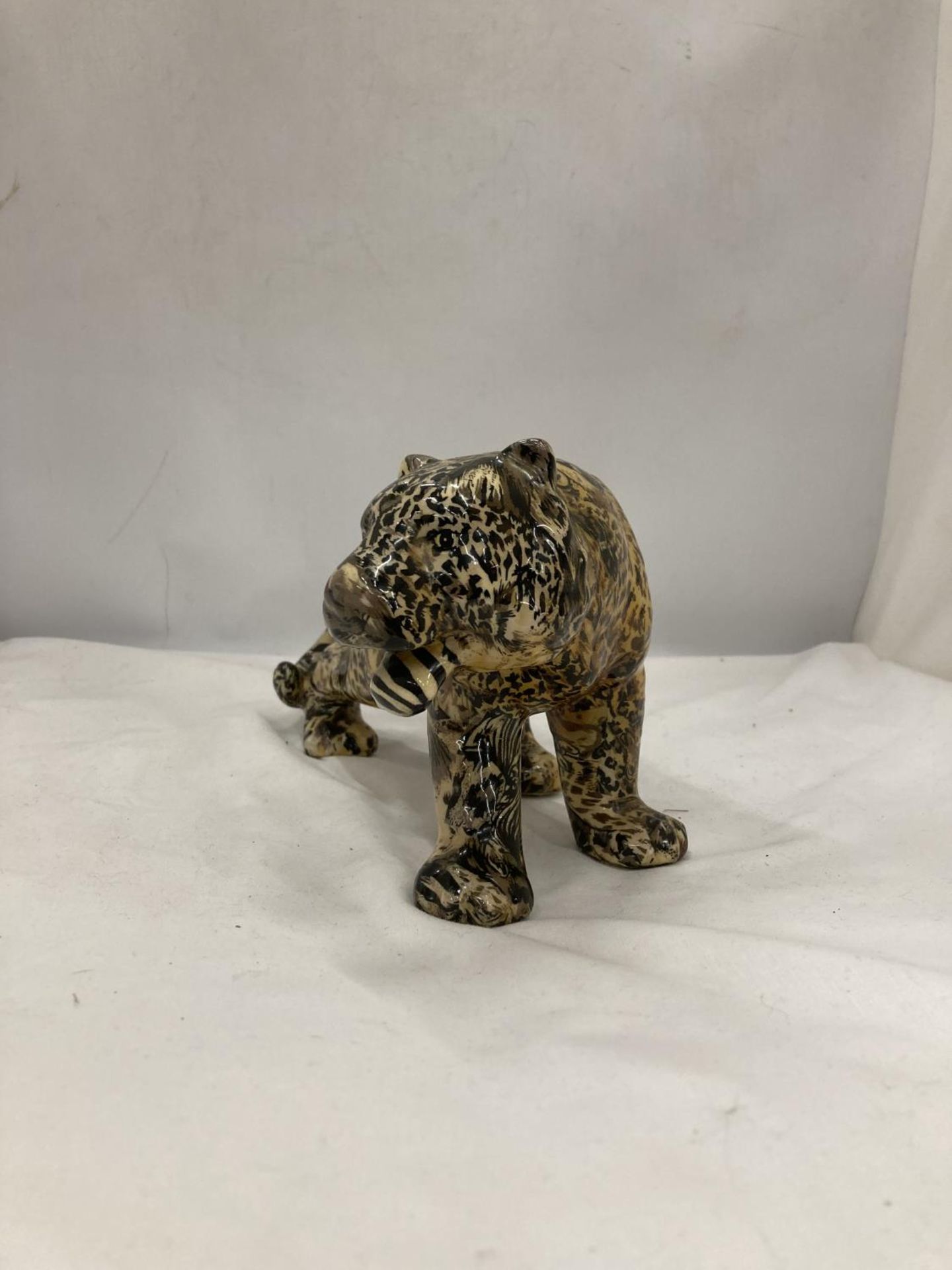 A MODEL OF A LARGE CAT WITH A PATCHWORK SAFARI DESIGN, HEIGHT 15CM, LENGTH 30CM - Image 2 of 3