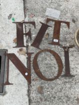 AN ASSORTMENT OF METAL SIGN MAKING LETTERS
