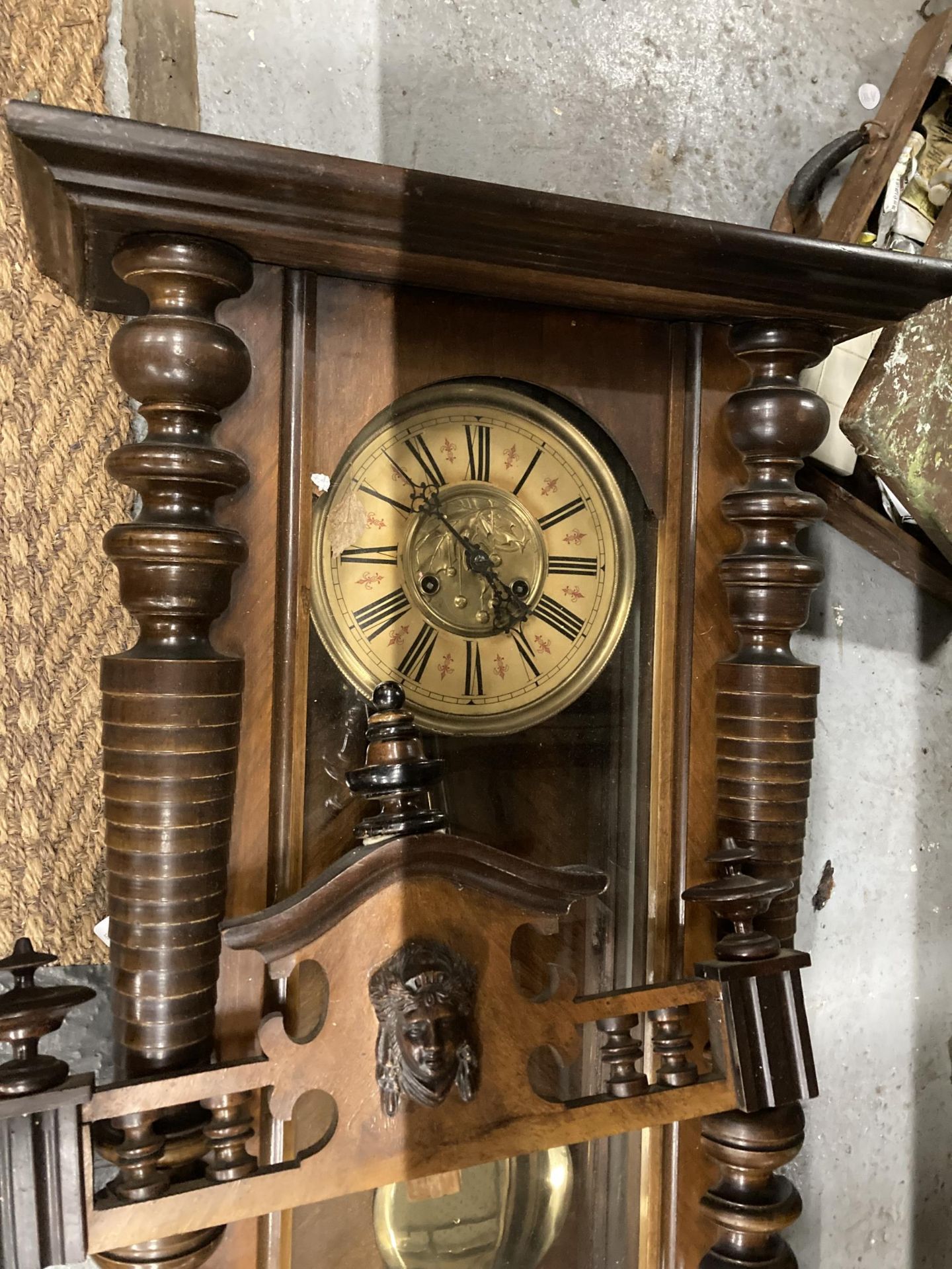 A CARVED WALNUT VIENNA WALL CLOCK WITH ROMAN NUMERALS AND PENDULUM - Image 2 of 4