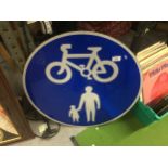 A BLUE AND WHITE ENAMEL CIRCULAR METAL ROAD SIGN