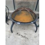 A LOW METAL FOUR LEGGED FIRE PIT