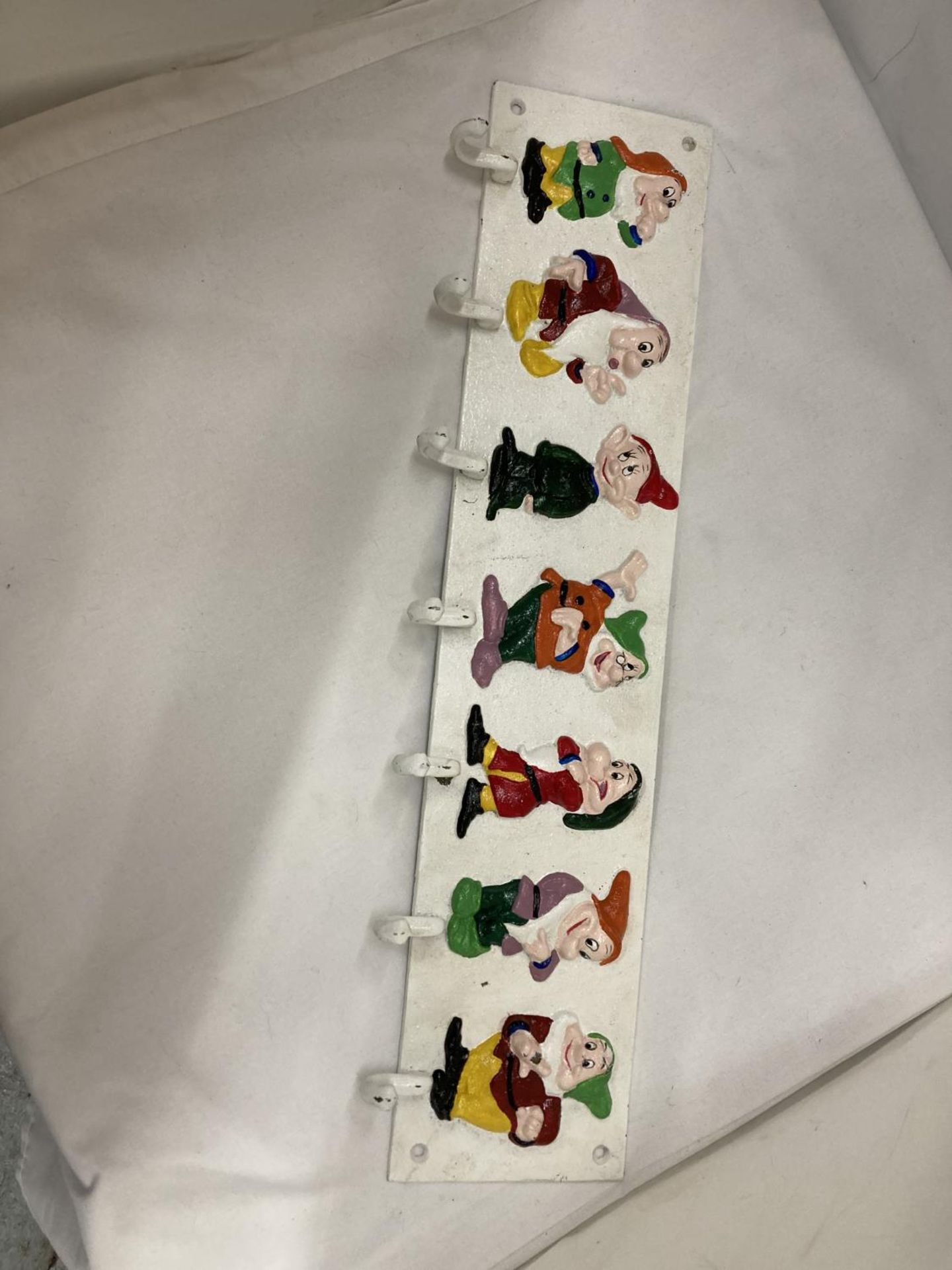 A HEAVY CAST HAND PAINTED 'SEVEN DWARFS' COAT RACK