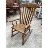 A VICTORIAN STYLE ELM AND BEECH ROCKING CHAIR