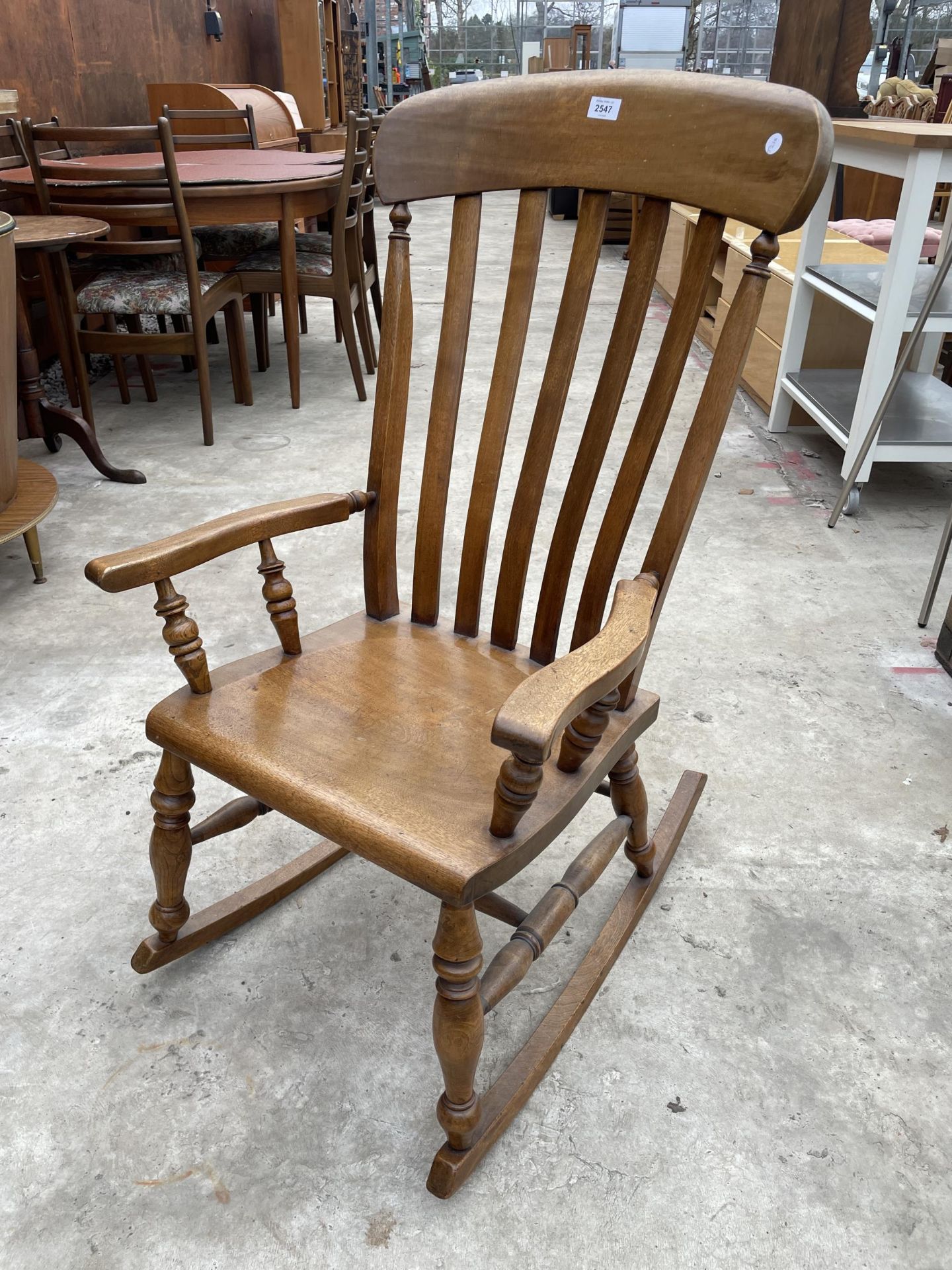 A VICTORIAN STYLE ELM AND BEECH ROCKING CHAIR