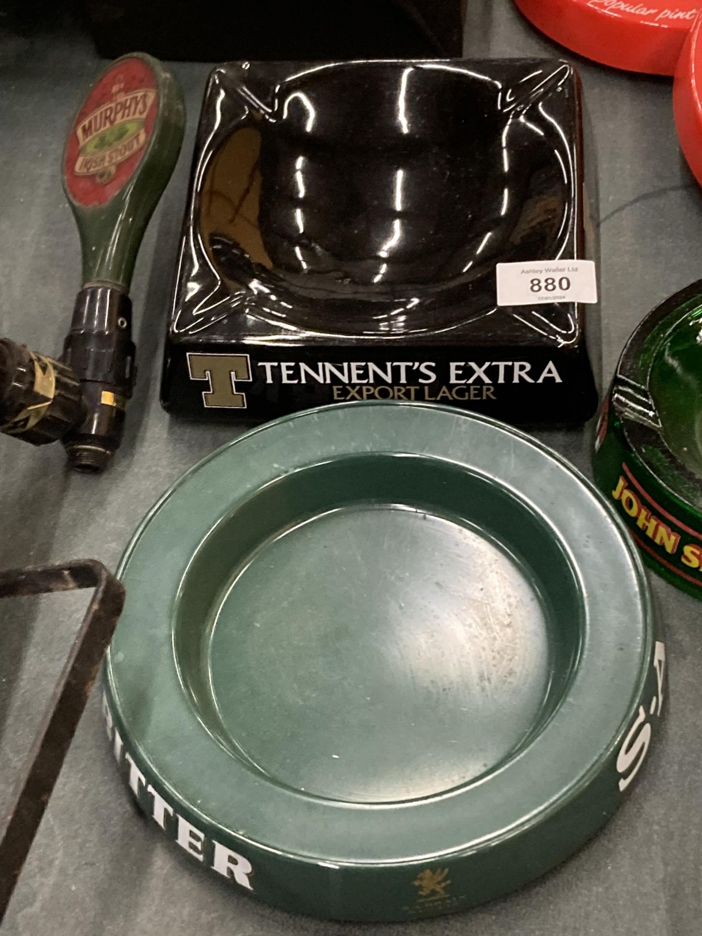 A TENNENT'S CERAMIC AND A S. A. BRAINS MELAMIME ASHTRAYS