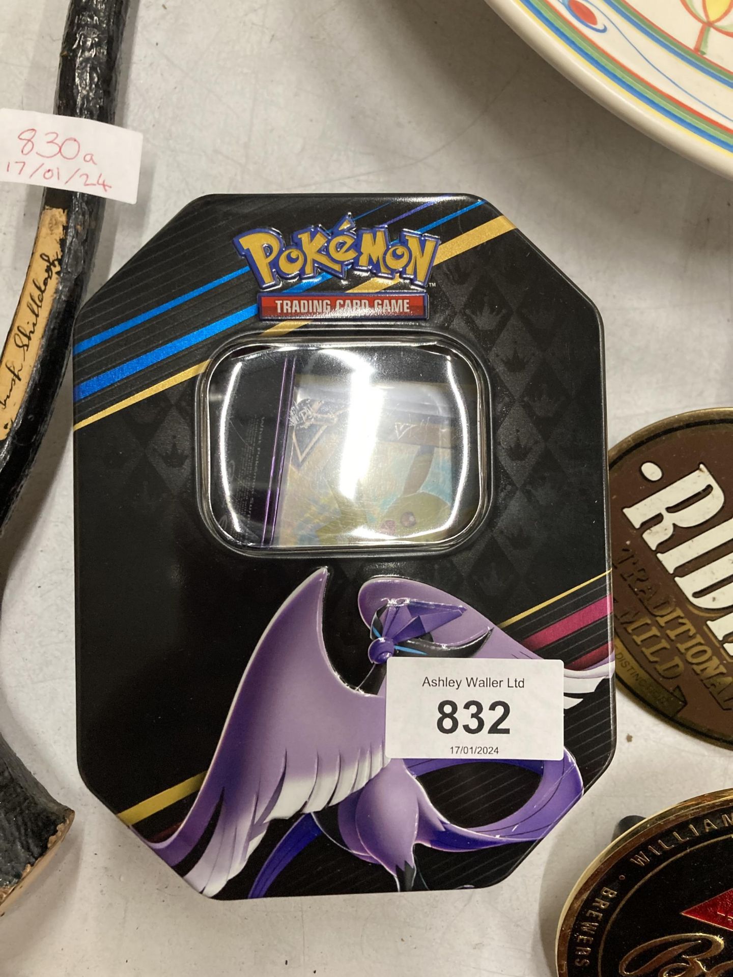 A POKEMON COLLECTORS TIN WITH 100+ CARDS, SEALED BOOSTERS AND MORE