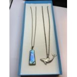 TWO SILVER NECKLACES WITH PENDANTS TO INCLUDE A DOLPHIN AND A BLUE STONE