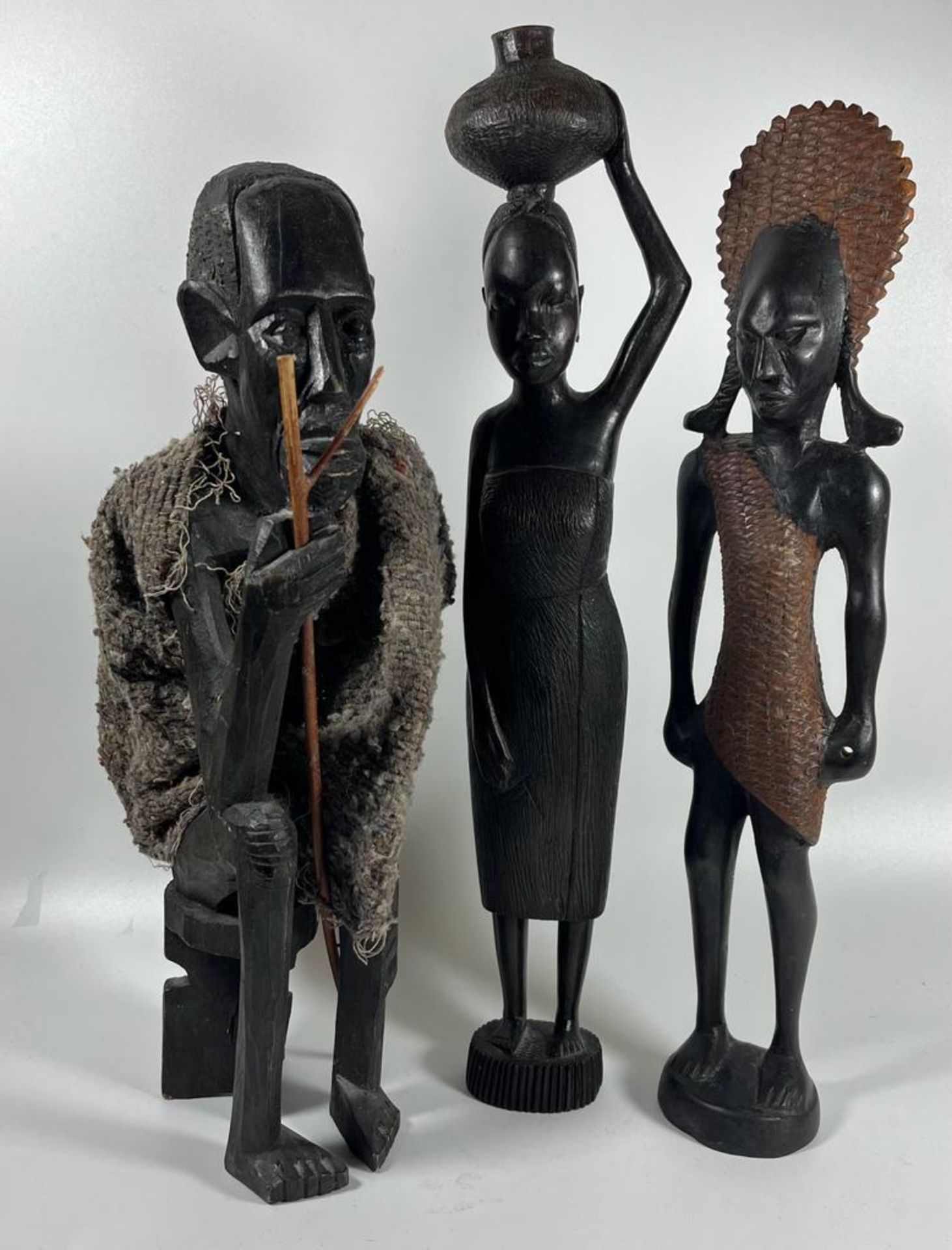 A GROUP OF THREE VINTAGE CARVED TRIBAL AFRICAN HARDWOOD FIGURES, HEIGHT 37 CM