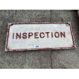 A VINTAGE CAST METAL 'INSPECTION' SIGN