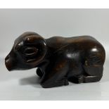 A VINTAGE AFRICAN TRIBAL HARDWOOD MODEL OF A RAM WITH SECRET UNDER CARRIAGE COMPARTMENT, LENGTH 27