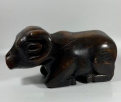 A VINTAGE AFRICAN TRIBAL HARDWOOD MODEL OF A RAM WITH SECRET UNDER CARRIAGE COMPARTMENT, LENGTH 27