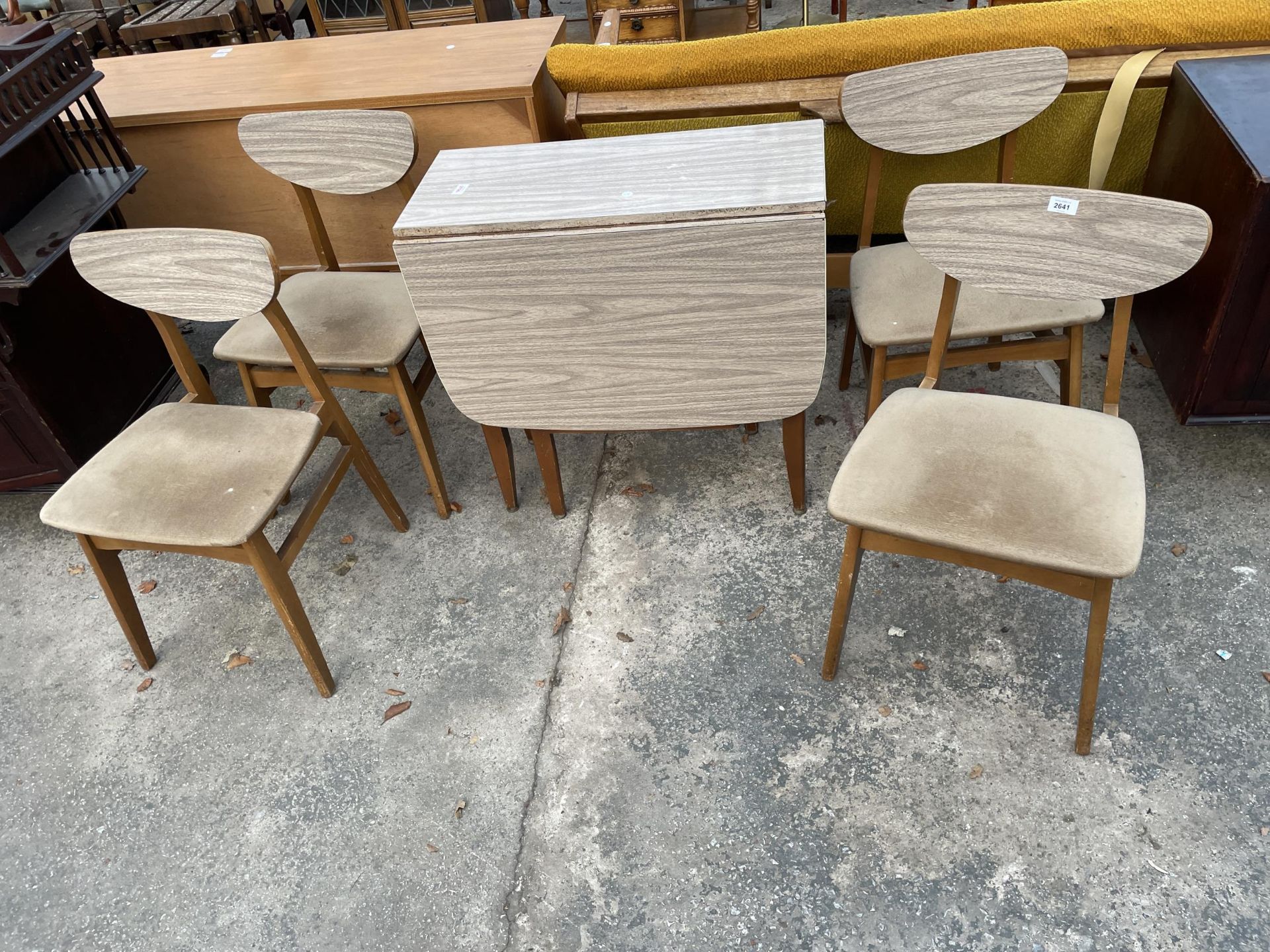 A RETRO FORMICA TOP DROP-LEAF KITCHEN TABLE AND FOUR MATCHING CHAIRS