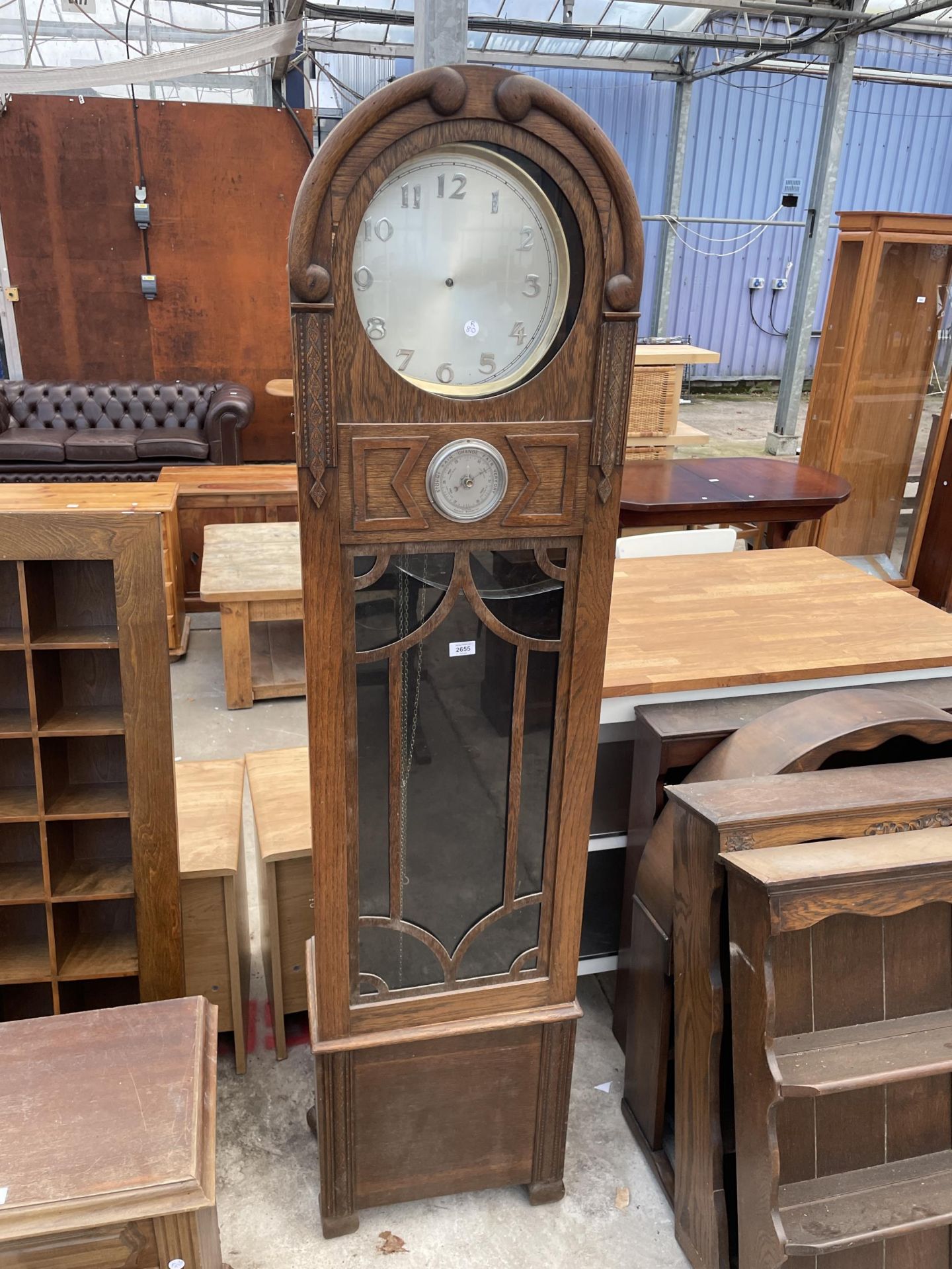 AN OAK ART DECO HALL LONGCASE CLOCK WITH GLASS DOOR