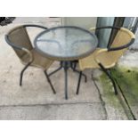 A GLASS TOPPED BISTRO TABLE AND TWO RATTAN EFFECT CHAIRS