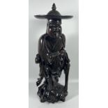 A LARGE ANTIQUE CHINESE CARVED ROOTWOOD FIGURE OF A MAN WITH BONE EYES AND TEETH, HEIGHT 41CM