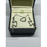 A BOXED SILVER NECKLACE AND EARRING SET
