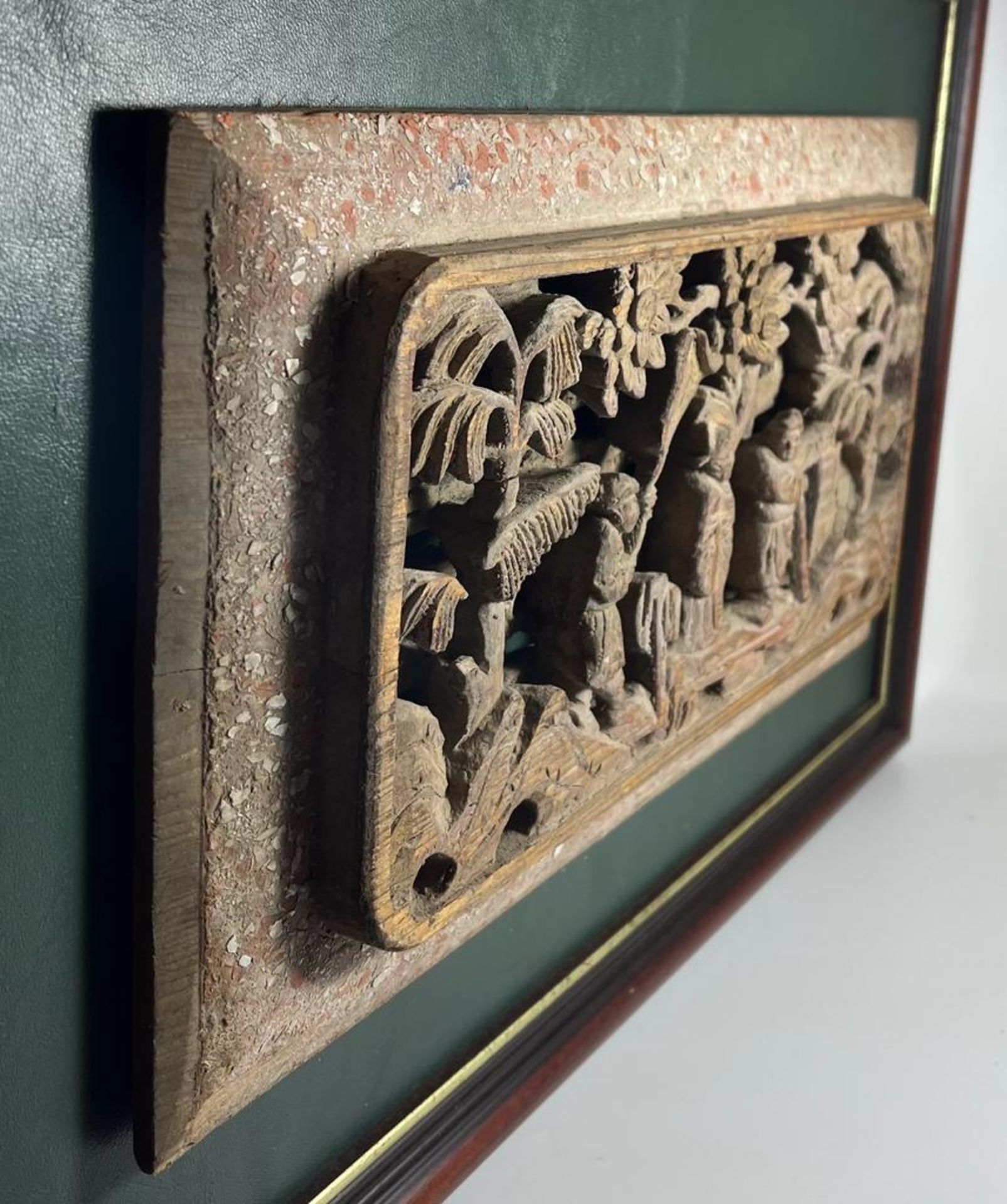 A CHINESE LACQUERED AND GILT CARVED WOODEN PANEL, ON LATER GREEN LEATHER MOUNT AND WOODEN FRAME, - Image 2 of 5