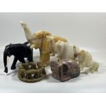 A COLLECTION OF HARDSTONE ELEPHANT FIGURES TO INCLUDE GROUP, SET OF FOUR, EBONY STYE AND LIDDED