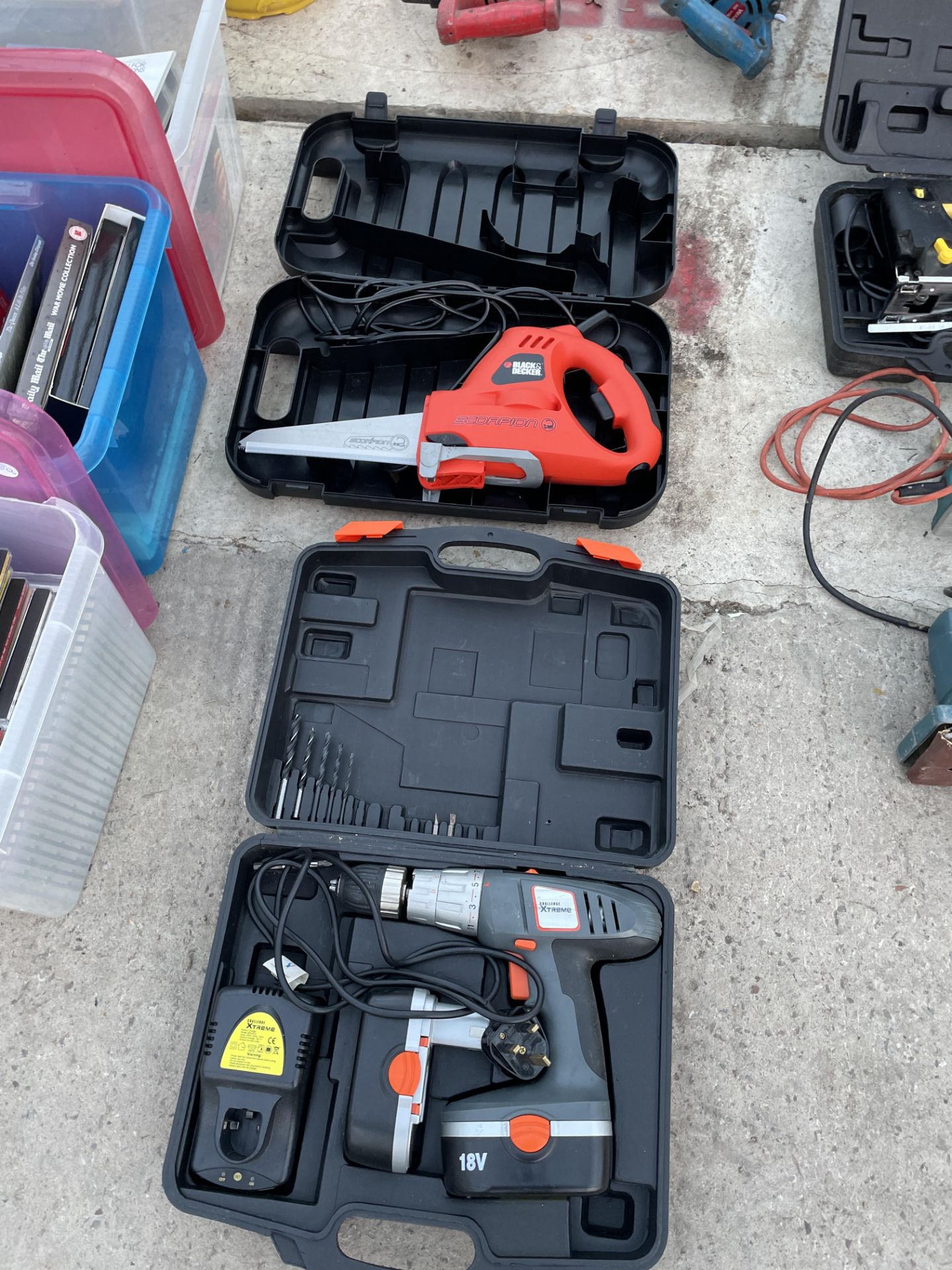 A CHALLENGE BATTERY DRILL AND A SCORPION ELECTRIC SAW